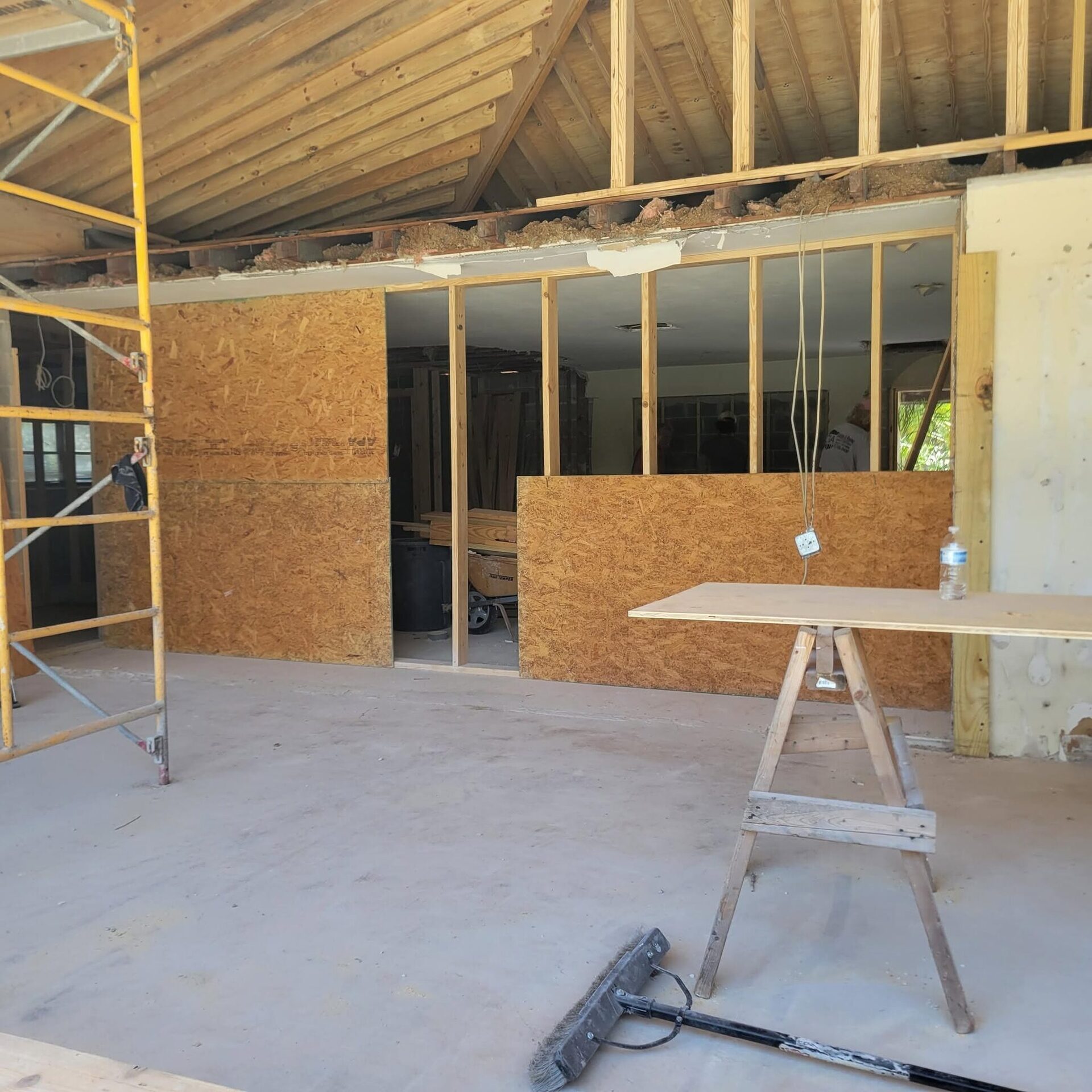 Interior framing of a home addition with new OSB sheathing, on a Reliant job