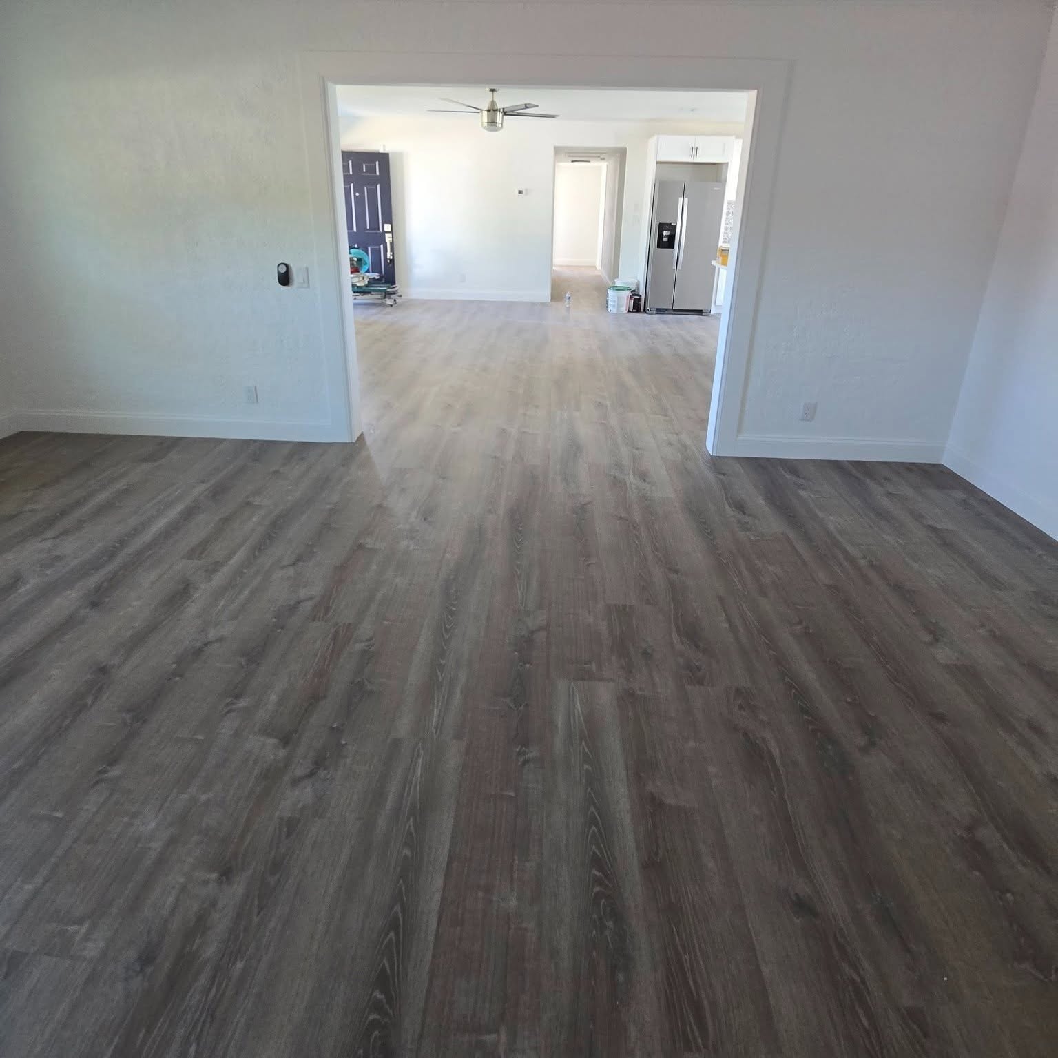 A finished, light-filled living room with new flooring after a Reliant remodel