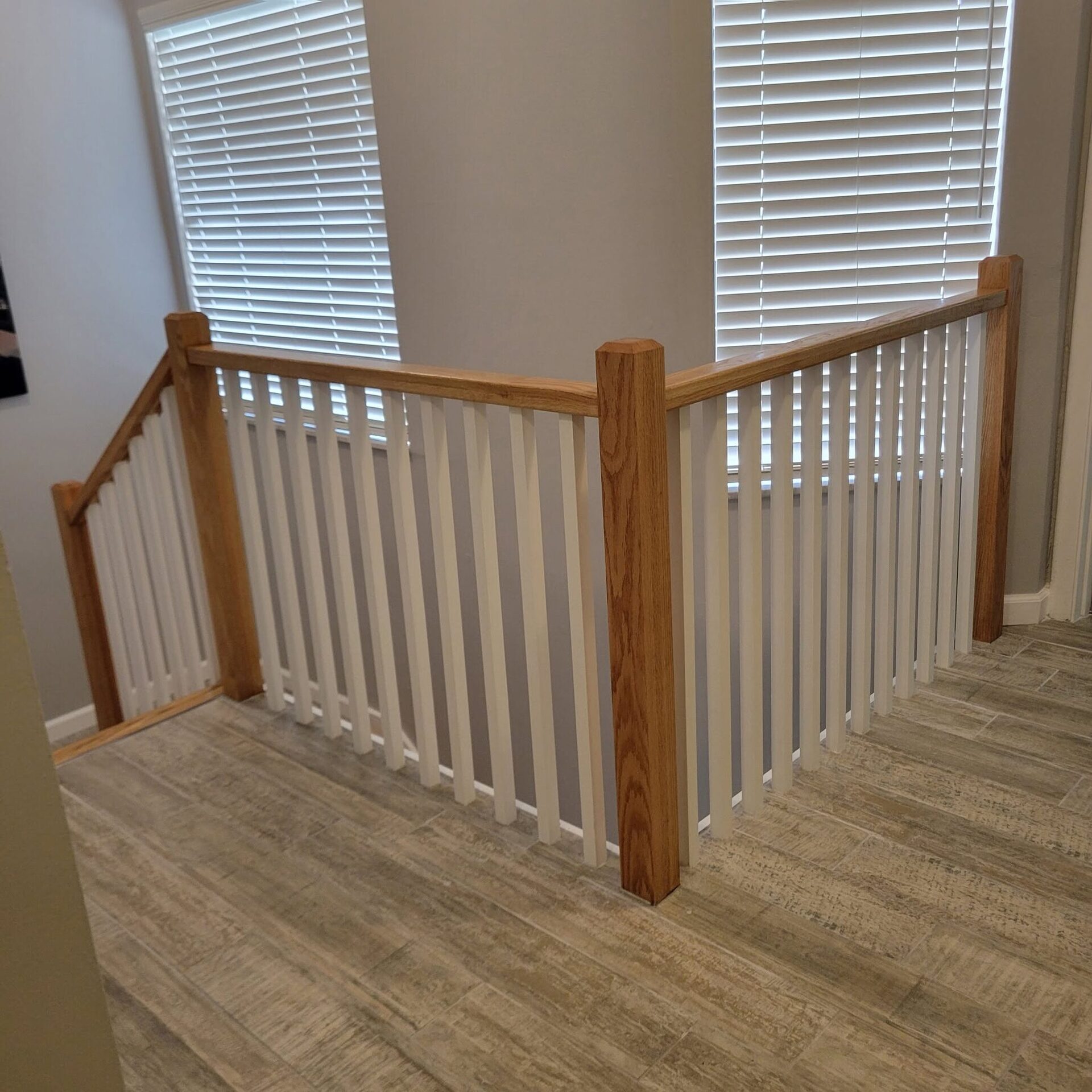 A remodeled staircase railing by Reliant Service Team